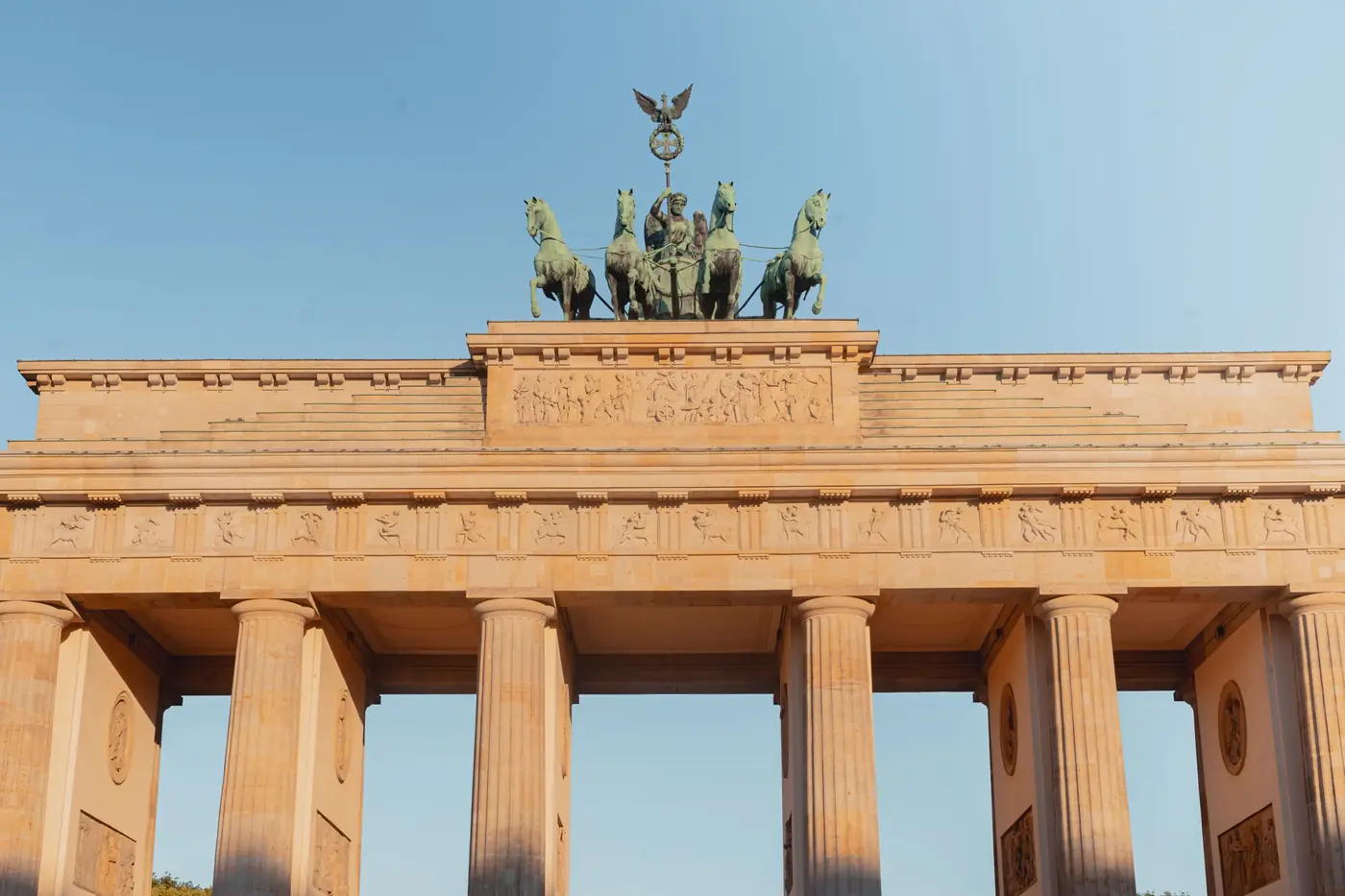 Brandenburg Gate in Berlin, Germany, lit by the evening sun