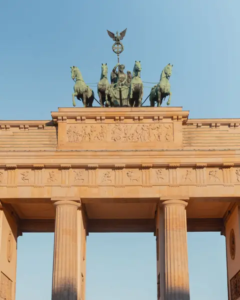 Brandenburg Gate in Berlin, Germany, lit by the evening sun